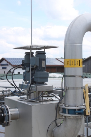 biogas digester with PV in the back